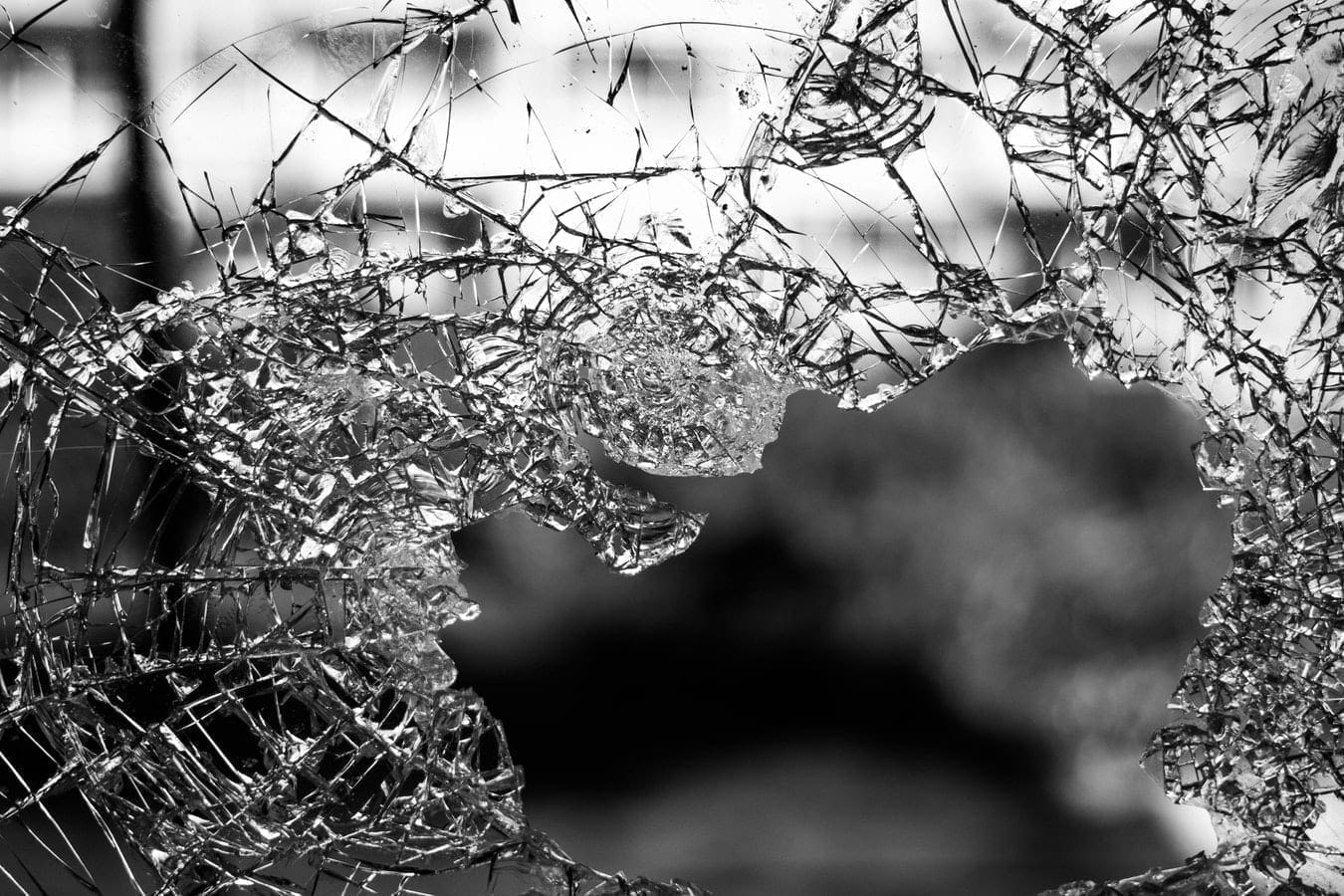 smashed and broken glass that needs insurance from vandals